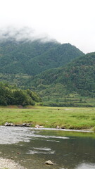 The beautiful mountains landscapes with the green bamboo forests and little country road as background in the countryside of the China