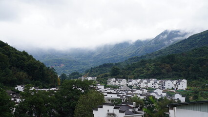The beautiful mountains landscapes with the green forest and little village as background in the countryside of the China