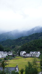 The beautiful mountains landscapes with the green forest and little village as background in the countryside of the China