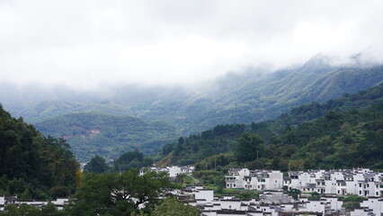 The beautiful mountains landscapes with the green forest and little village as background in the countryside of the China