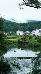 The beautiful mountains landscapes with the green forest and little village as background in the countryside of the China