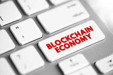 Blockchain Economy - potential future environment in which cryptocurrency replaces current monetary systems, text concept button on keyboard