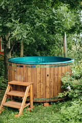 Wooden Outdoor Hot Tub in Green Garden Retreat