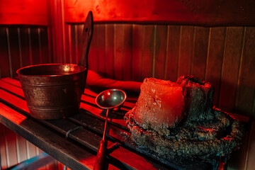 Close-Up of Sauna Candle and Ladle with Warm Lighting