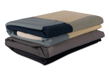stack of colored bed linen isolated on white background