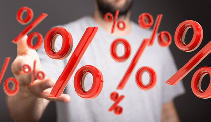 Red percentage symbols float towards a person's hand, symbolizing discounts, interest rates, or...