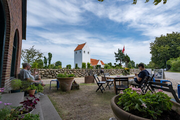 People enjoying the summer at a cafe, on a Danish island, in July