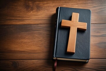 Christian cross and Bible on wooden background, top view with space for text. Religion concept.