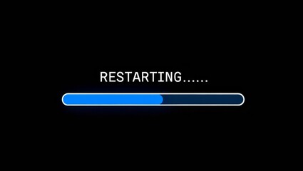 A black computer screen displaying a loading icon during system restart.