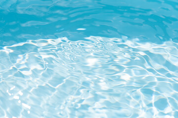 Blue water with ripples on the surface. Defocus blurred transparent blue colored clear calm water...