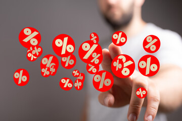 Financial marketing image.  Percentage symbols floating around a hand. Ideal for business, finance,...