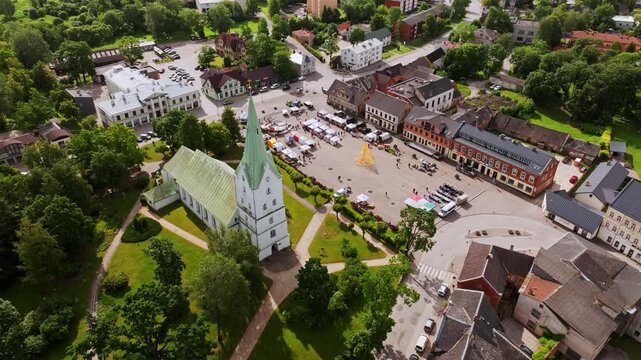 Aerial view of Dobele Latvia with Līgo festival market and white church, Europe
