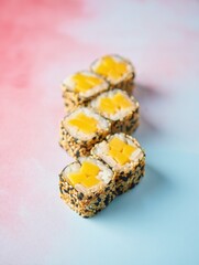 Bright Sushi Rolls with Mango on Colorful Background
