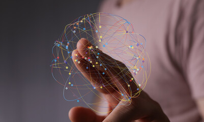 Abstract image of a hand holding a network, representing connection and global communication.