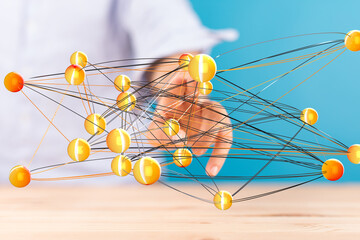 Abstract image of a hand interacting with a complex network of interconnected nodes, representing...