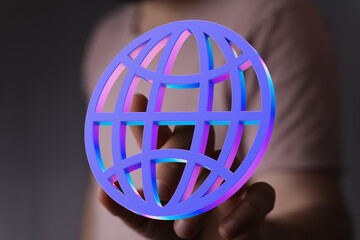 Abstract image of a person holding a digital globe, representing global connectivity and networking.