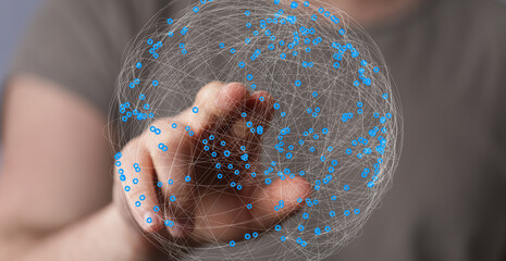 Person's finger interacts with a digital globe, symbolizing global network connection and data...