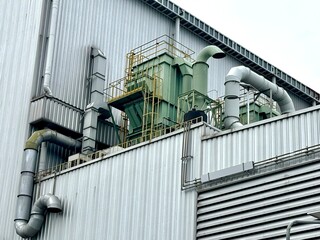 Industrial air filtration and ventilation system on a factory rooftop. Large ducts and exhaust...