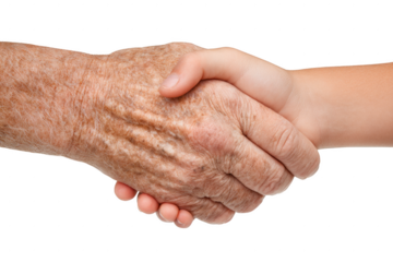 Two hands shaking hands, one of which is old and wrinkled