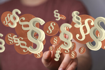 Abstract image of paragraph symbols floating, representing law, legal, justice, and regulation.