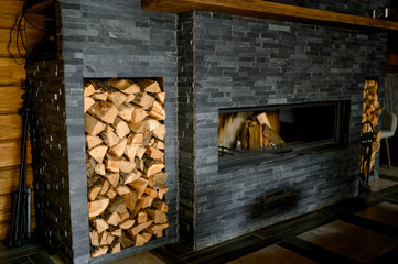 fireplace in the house with a woodpile