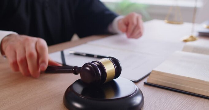 Trial, final decision, law court judge, gavel wooden hammer close up bangs to sentence in court, accuse guilty, proclamation, passes judgment, hitting on table to get attention, punctuate rulings