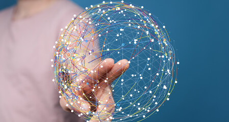 Person interacts with a digital sphere representing global network connections. Technology,...