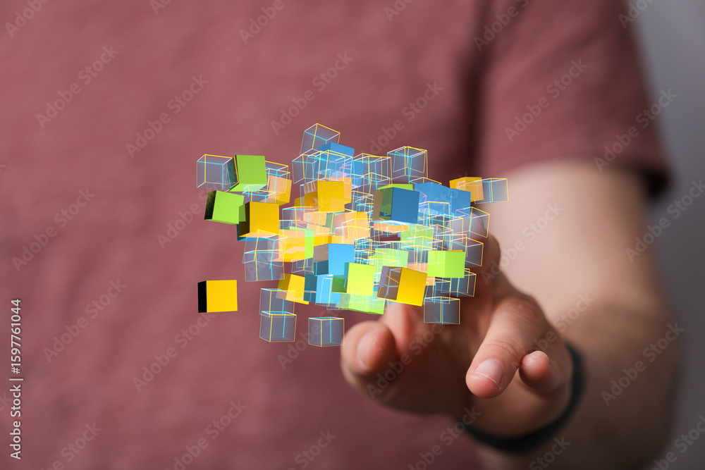Poster abstract image of a hand interacting with a cluster of colorful 3d cubes, representing data, technol