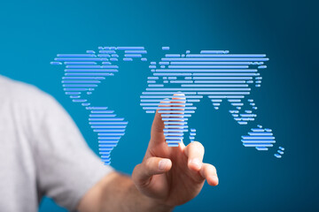 Hand interacting with digital world map.  Global business, technology, and connection concept.