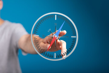 Hand interacting with a virtual compass, symbolizing guidance, direction, and decision-making.