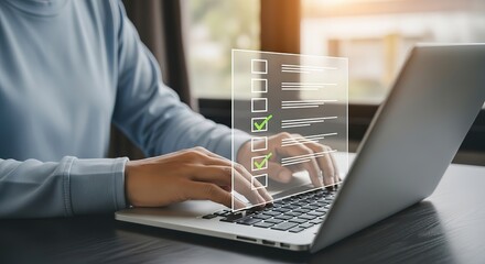 Person typing on a laptop with a digital interface displaying data and progress bars