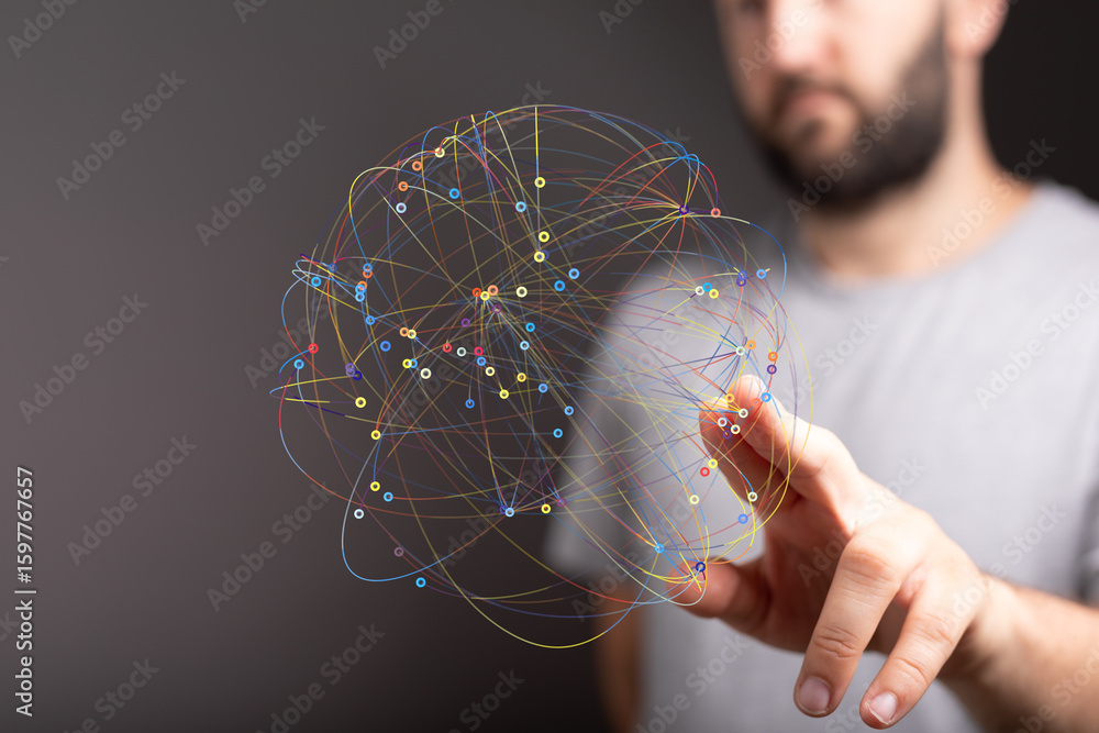 Poster a man interacts with a digital sphere representing global connections and networking.