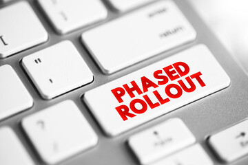 Phased Rollout is a hardware or software migration method that involves incrementally implementing a new system, text concept button on keyboard