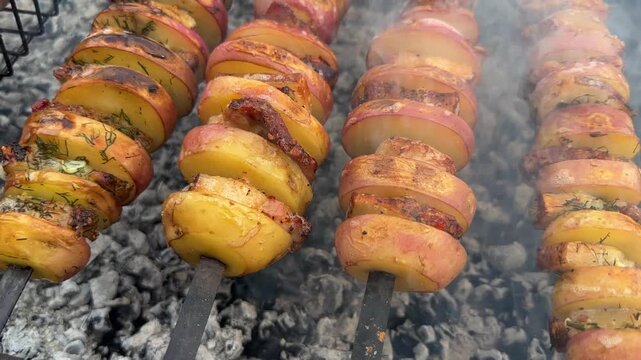Grilled potatoes with bacon outdoor cooking