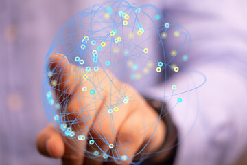 Abstract image of a hand interacting with a digital network. Represents connection, technology, and...