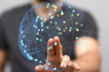 Abstract image of a hand interacting with a digital global network. Represents connection,...
