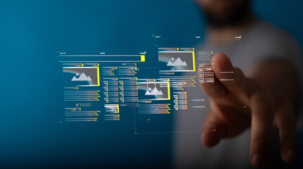 Person interacts with a digital interface showing website design elements.  Modern technology concept.