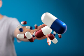 Image of hand holding many colorful medicine capsules. Healthcare, pharmacy, medicine concept.