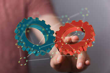 Image of two gears meshing, symbolizing teamwork, collaboration, and efficient processes.
