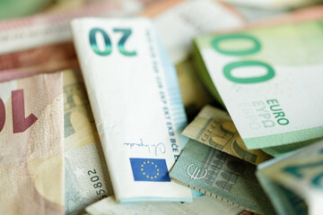 Close-up shot of various Euro banknotes piled together.  Ideal for finance, economy, and money...