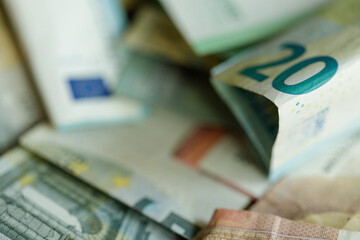 Stock photo of a pile of money, including Euro and US dollar banknotes.  Perfect for finance,...