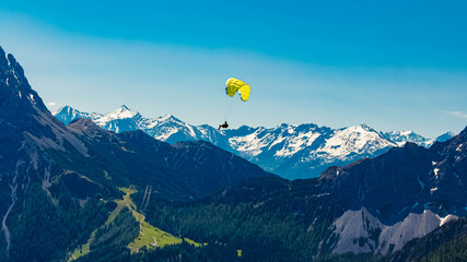 Alpine summer view with a paraglider at Mount Grubigstein,Lermoos, Reutte, Tyrol, Austria