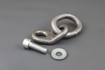 Close up of lifting bracket kit or shackel and bolt isolated on grey background. Rigging tool
