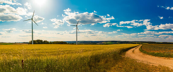 High resolution stitched agricultural summer panorama with wind power plants near Kugl, Simbach,...