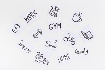 Life balance concept. Many paper cards with hand drawing of different life activities