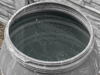 Rainwater collected in a barrel on the plot for watering the garden