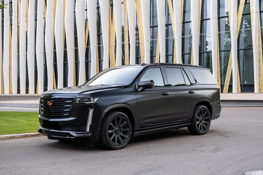off road vehicle Cadillac Escalade is a full-size luxury SUV manufactured by General Motors Black logo detail car on the road