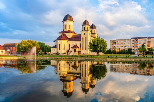 Sebeș, Alba county, Transylvania, Romania: The Orthodox Cathedral reflected in the lake water at sunset
