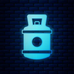 Glowing neon Propane gas tank icon isolated on brick wall background. Flammable gas tank icon. Vector