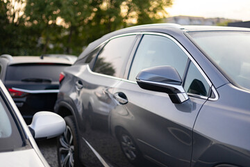 A row of cars parked outdoors, showcasing modern automotive design and urban transportation.